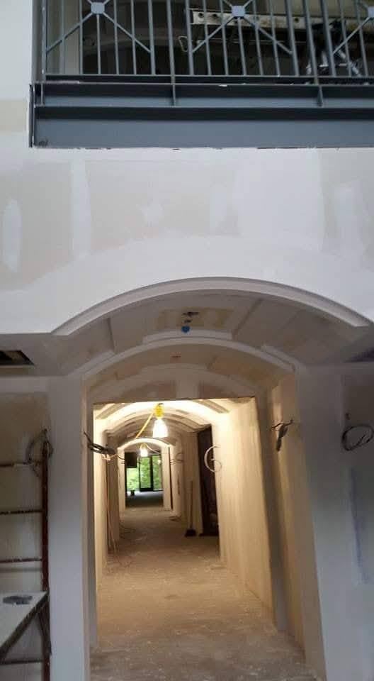 Custom arched drywall corridor
